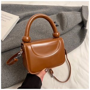 Mini sac à main chic en cuir marron avec poignée cylindrique et bandoulière amovible