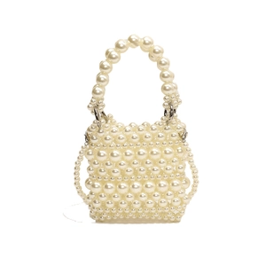 Elegant ivory handmade pearl woven crossbody bag with a round handle and beaded strap