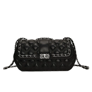 Classic black quilted leather shoulder bag with silver chain strap and metal turn-lock