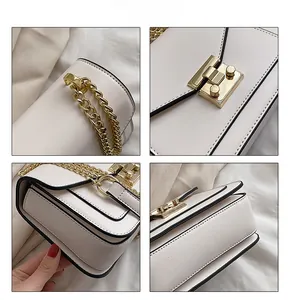 Detailed close-up of cream square bag with gold hardware, chain strap and black piping