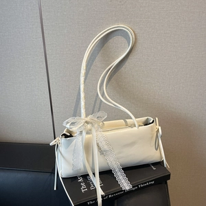 Chic cream white pleated pillow bag with lace bow detail and slim shoulder strap