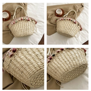 Detail view of woven straw tote bag with colorful fringe tassels and artisan texture