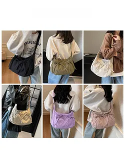Detail view of colorful canvas crossbody bags with decorative bow knots in six trendy colors