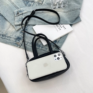 Mini black lychee leather handbag with dual handles and iPhone shown for size reference