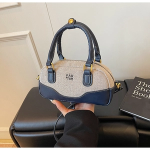 Mini canvas and navy leather bowling handbag with PAN TOR logo and gold hardware detail