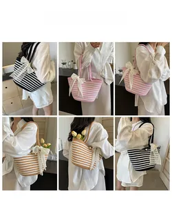 Three striped woven beach bags with lace bow and pearl detail shown in lifestyle shots