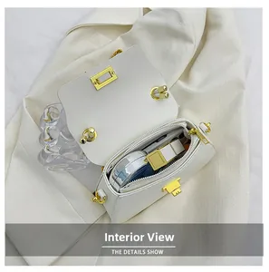 Detail view of the white chain bag interior showing space for phone and makeup