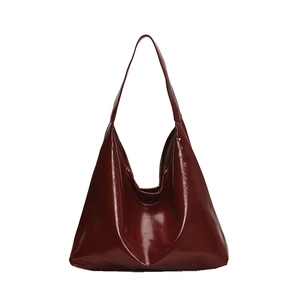 Minimalist burgundy patent leather large tote bag shown in a classic front view