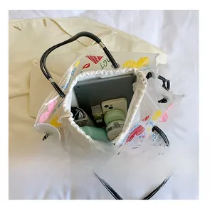 Macro view showing large capacity of transparent tote bag with canvas inner pouch