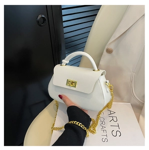 Close-up of white PU leather crossbody bag with golden chain and square metal buckle