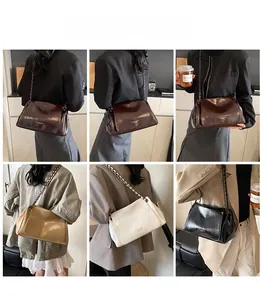 Model display of vintage chain crossbody bags in dark brown, beige, white and black colors