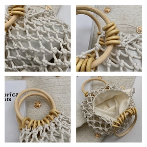 Detail of hand-woven mesh handbag with round wooden handles and drawstring inner bag