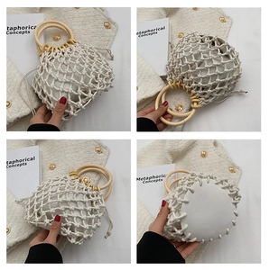 Detail of woven bucket bag with wooden ring handles and drawstring inner liner