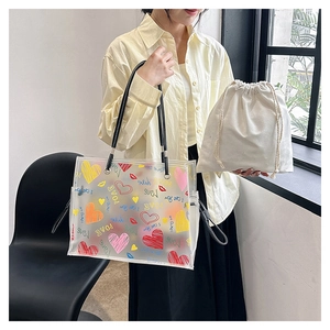 Detail of transparent PVC tote bag with love heart graffiti and canvas inner pouch