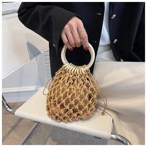 Handmade woven straw shoulder bag with wooden ring handles and drawstring liner
