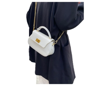 Minimalist white PU leather crossbody bag with golden chain and metallic twist lock