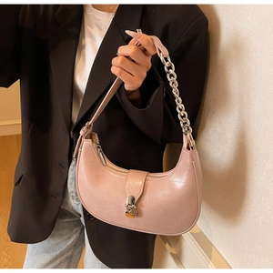 Detailed view of pink moon bag with lychee texture leather and silver chain strap
