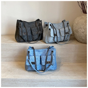 Three quilted denim chain bags in grey and blue with metallic twist-lock pockets