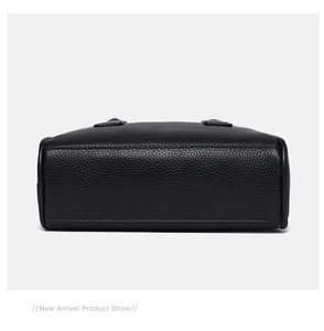 Detail view of the black lychee pattern leather bowling bag base with reinforced stitching