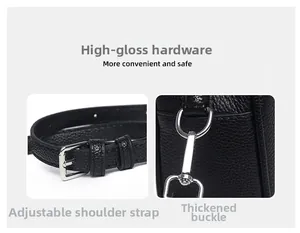 Detailed view of black pebble leather strap with adjustable silver buckle and snap hook