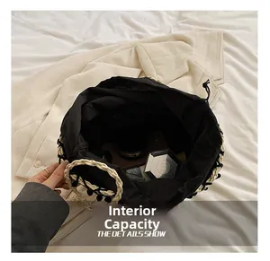 Internal view of handmade straw bucket bag with drawstring liner showing large capacity