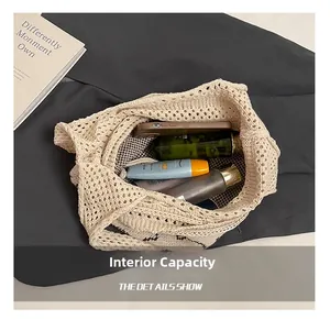 Top view of beige knit tote bag interior showing capacity for phone and cosmetics