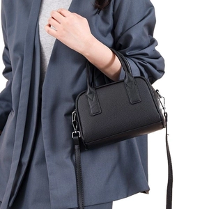 Classic black bowling bag with lychee texture and detachable shoulder strap for women