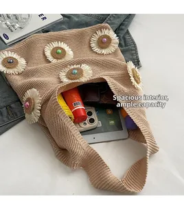 Interior view of floral knit tote showing large capacity with tablet and accessories