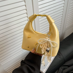 Yellow PU dumpling bag with bear badges, pearl chain and lace accents, 2025 chic style