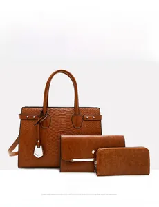 Detailed view of the three-piece brown crocodile pattern tote bag set and wallet