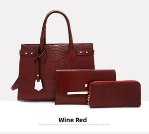 Detailed view of wine red crocodile embossed tote, clutch and zipper wallet 3-piece set