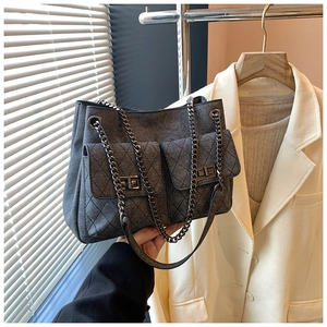 Retro grey denim chain shoulder bag with quilted front pockets and metallic twist locks
