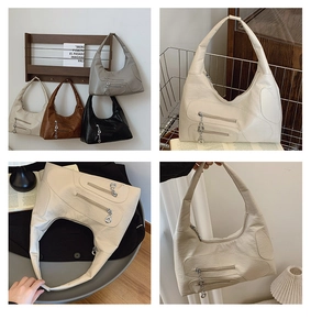 Detail view of large nylon hobo bag featuring twin parallel zippers and silver ring pullers