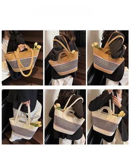 Détails d'un sac cabas en paille tissée avec motifs bicolores et anses rondes