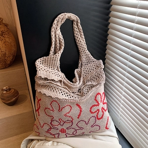 Bohemian beige knit tote bag with red floral patterns and ruffled edge detail