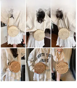 Detail of handmade woven straw crossbody bags with intricate radial patterns and zipper closure