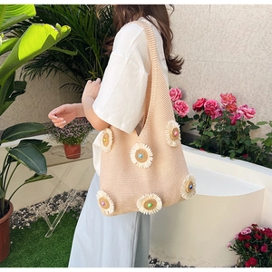 Beige hand-woven knit tote bag with 3D white daisy flowers for summer vacation
