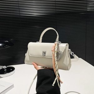 Chic off-white faux leather flap crossbody bag with top handle and silver twist lock
