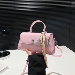 Pink rectangular crossbody bag with silver twist lock and colorful scarf detail