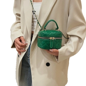 Vintage green quilted mini vanity bag with gold chain strap and top handle for women