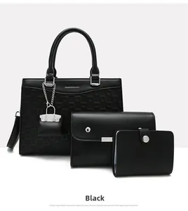 Three-piece black handbag set with geometric texture and crossbody bag plus wallet