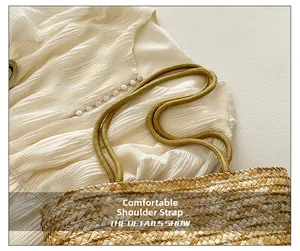 Detail of hand-woven straw bucket bag showing textured rope strap and natural finish