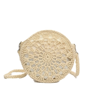 Handmade cream woven round straw shoulder bag with fringe tassel for beach vacations