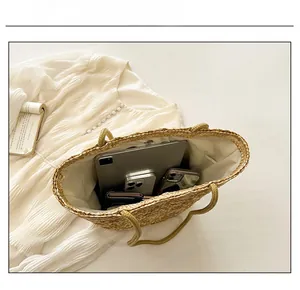 Top view of handwoven straw bucket bag showing large interior capacity with lining