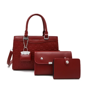 Three-piece burgundy leather tote bag set with textured pattern and silver metal hardware