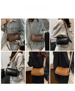 Détail du sac bandoulière vintage montrant la sangle jacquard et le simili cuir texturé