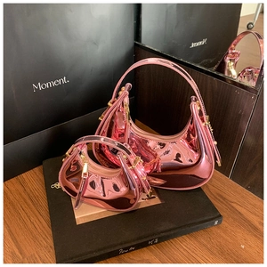 Detail of pink metallic hobo bags in two sizes with glossy finish and gold zippers
