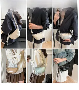 Detail view of crescent crossbody bags in six colors with knotted straps and metal charms