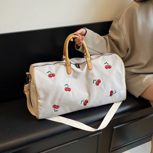 Canvas travel tote bag with red cherry embroidery and yellow handles for women