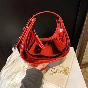 Mini red patent leather crescent bag with mirror finish and gold chain strap